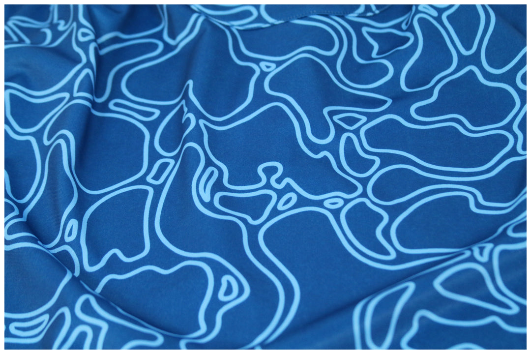 "Island Coral Makai Blues" - OGA Youth Polo - Blues