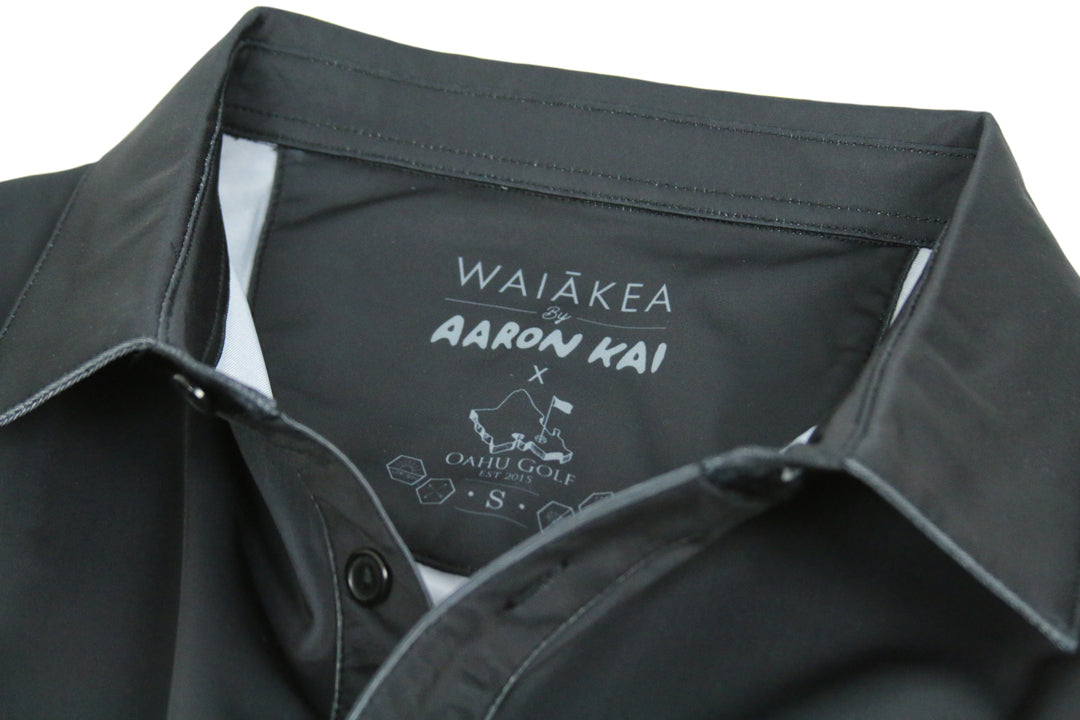"Waiakea Obsidian Waves" - OGA X Waiakea Water X Aaron Kai Collab Men's Polo - Obsidian Black